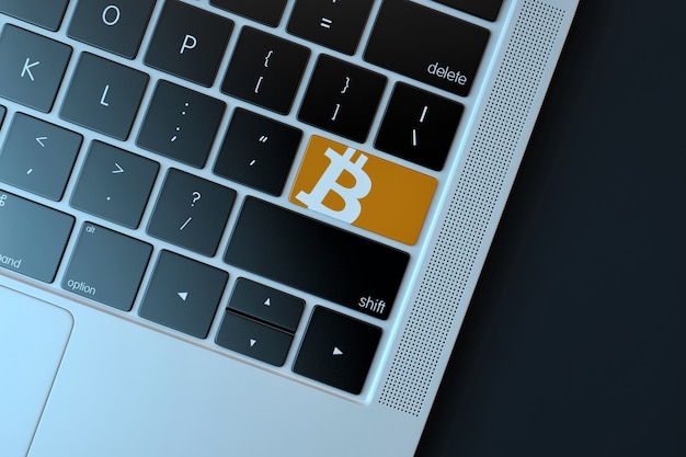 Ícone Bitcoin no teclado do laptop. Conceito de tecnologia