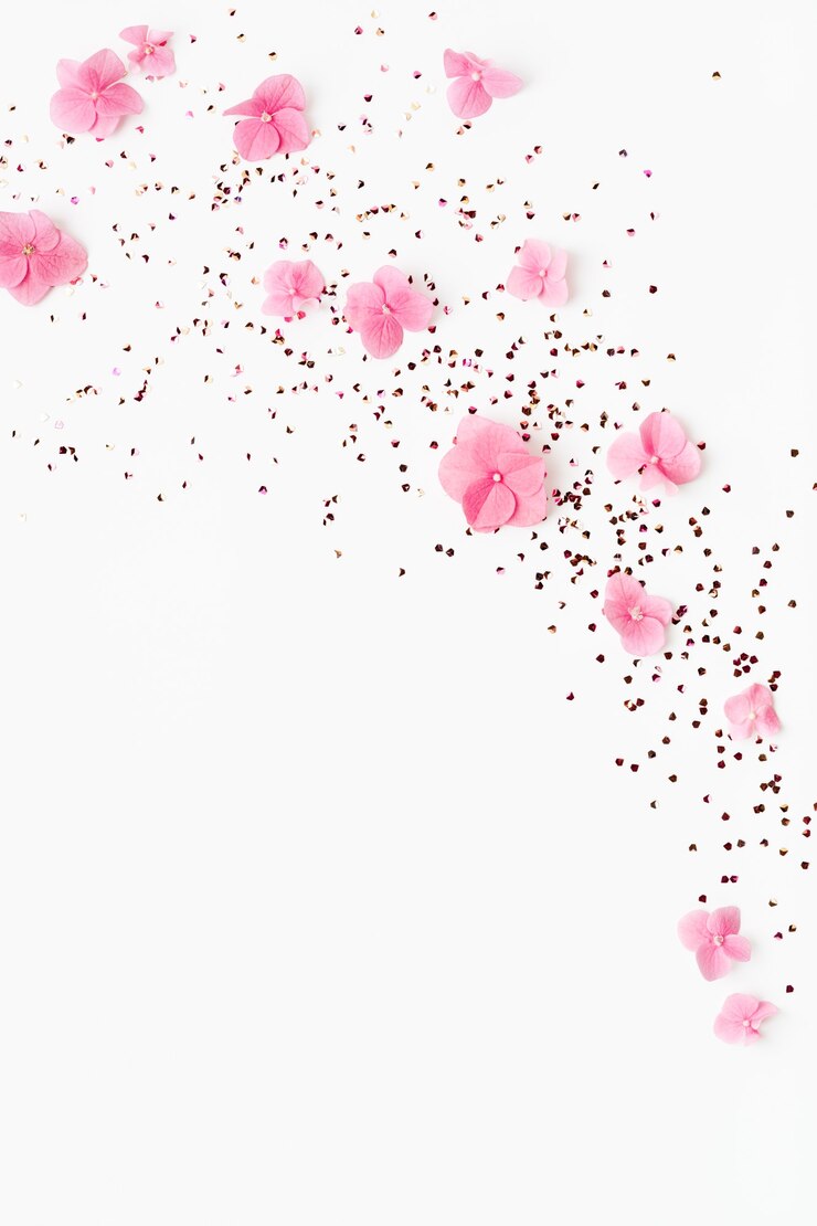 Foto confete glitter e flores cor de rosa respingam no fundo branco