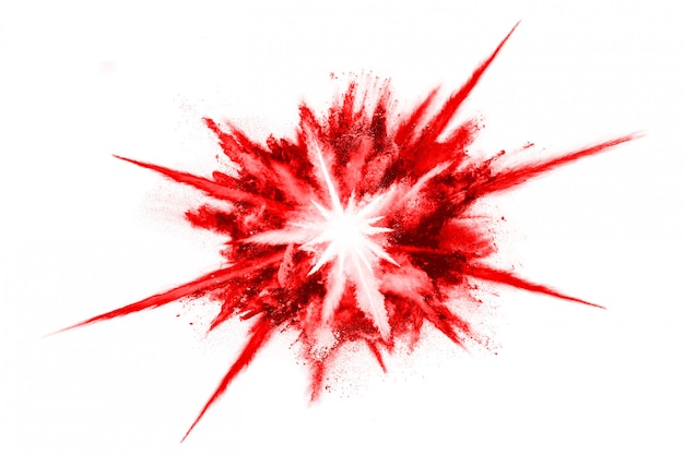 Foto congelar movimiento de explosión de polvo rojo, aislado sobre fondo blanco.
