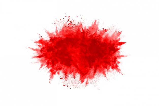 Foto congelar el movimiento de polvo rojo explotando, aislado