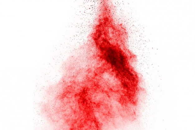 Congele el movimiento de la explosión roja del polvo, aislado en el fondo blanco.