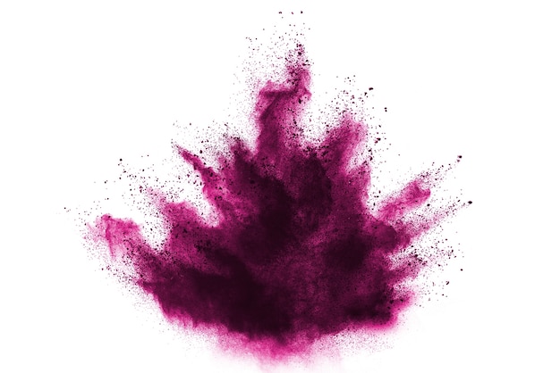 Foto congele el movimiento de las explosiones rosadas del polvo aisladas en el fondo blanco.