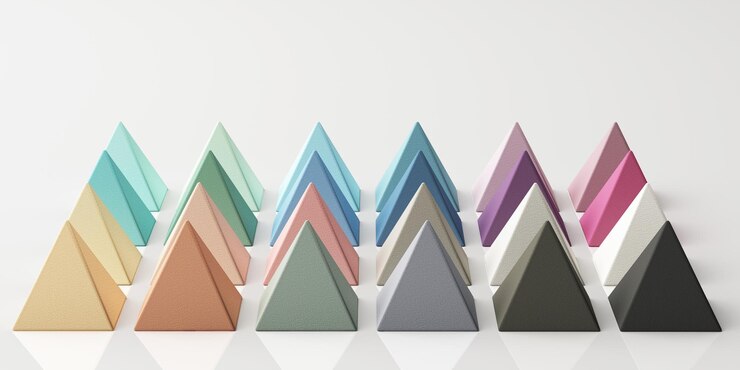Foto conjunto de coloridas esferas piramidales verdes, púrpuras, azules y amarillas realistas con textura de tela en fondo blanco renderización 3d