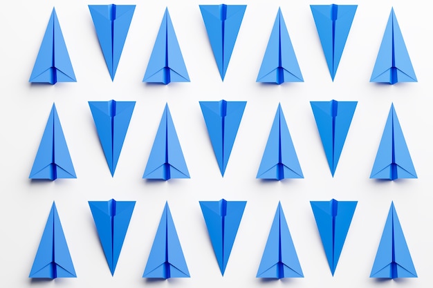 Foto conjunto de aviões de papel azul em fundo branco