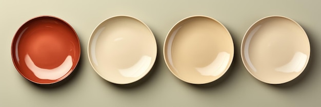 Un conjunto elegante de platos de comedor de porcelana minimalista aislados en un fondo de gradiente taupe