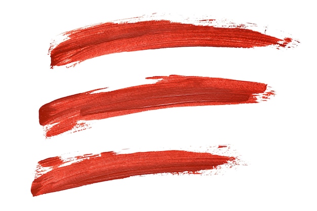 Conjunto de líneas de pintura roja aisladas sobre fondo blanco.
