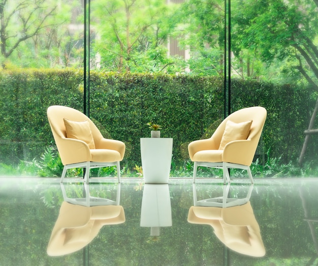 Foto conjunto de sofá amarillo y mesa pequeña en la sala de estar