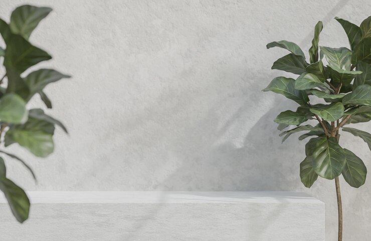 Contador de mesa de hormigón con planta y fondo de textura grunge de concreto
