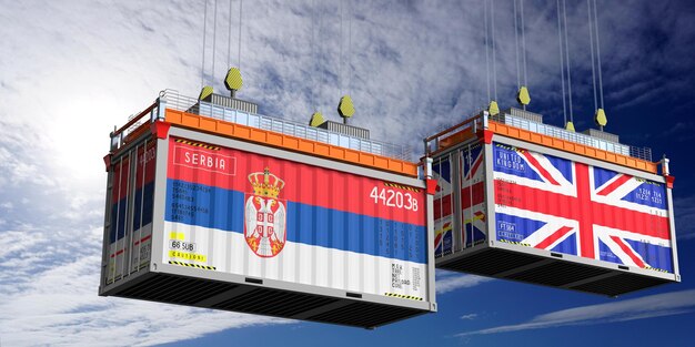 Contenedores de transporte con banderas de Serbia y el Reino Unido Ilustración 3D