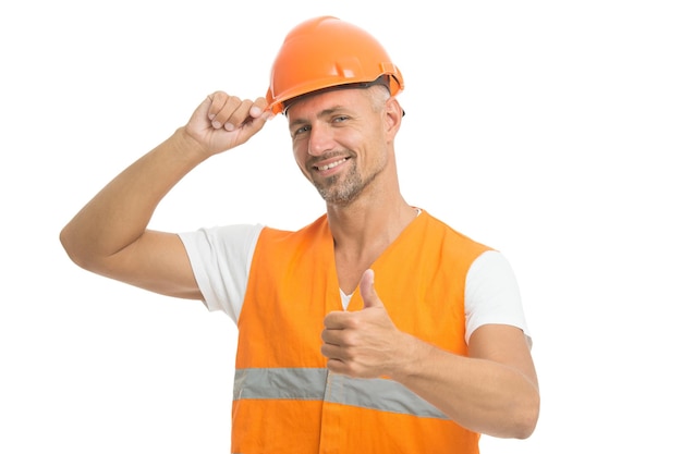 Controle do inspetor. Controle do arquiteto. Tudo está sob controle. Conceito de segurança. Homem usa uniforme e capacete de proteção. Construtor alegre. Conceito de equipamento de proteção. Belo construtor.