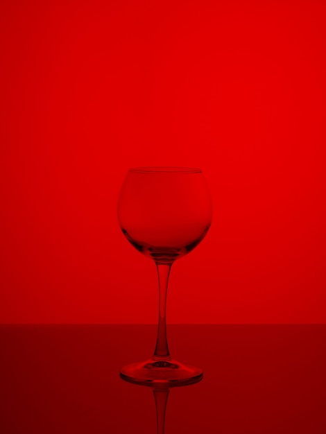 Copa de vino sobre un fondo rojo.