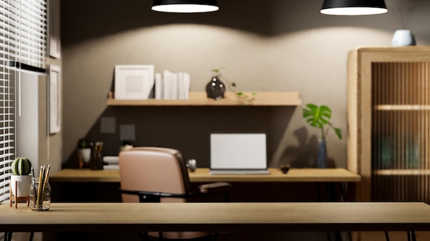 Foto copie el espacio en la mesa de madera sobre el fondo borroso de la oficina en casa moderna y elegante