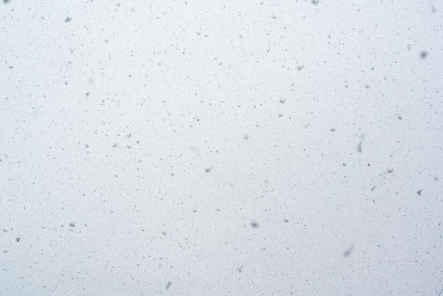 Copos de nieve de textura de nevadas en diseño de clima de fondo borroso Foto de alta calidad