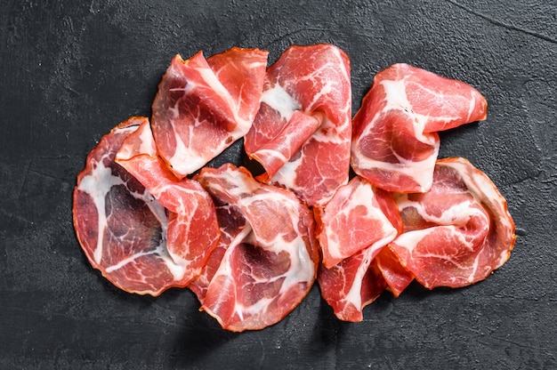 Coppa, Capocollo, Capicollo Fleisch. Schwarzer Hintergrund.