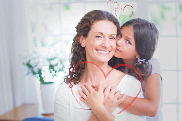 Foto coração contra feliz mãe e filha abraçando