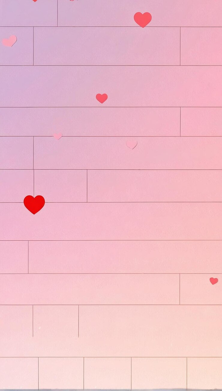 Foto corações numa parede rosa.