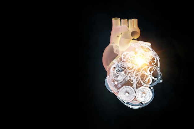 Corazón humano hecho de mecanismos y elementos. Técnica mixta