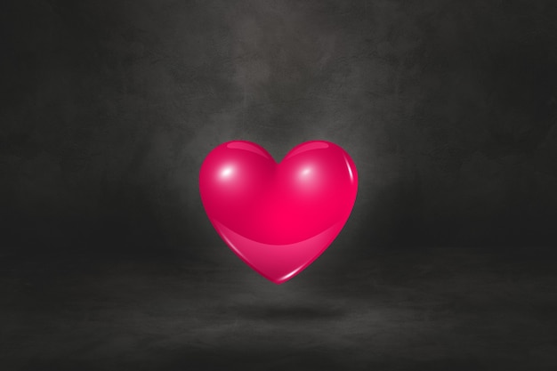 Corazón rosado 3D aislado en un fondo negro del estudio. Ilustración 3D