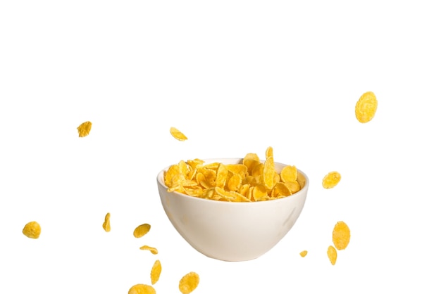 Cornflakes fallen auf die weiße Schüssel