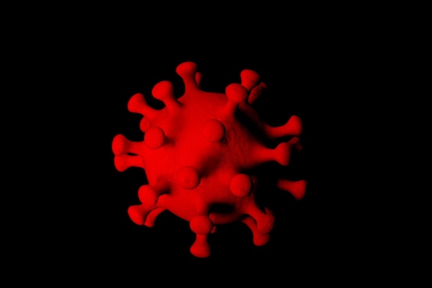 Coronavírus vermelho em fundo preto close-up