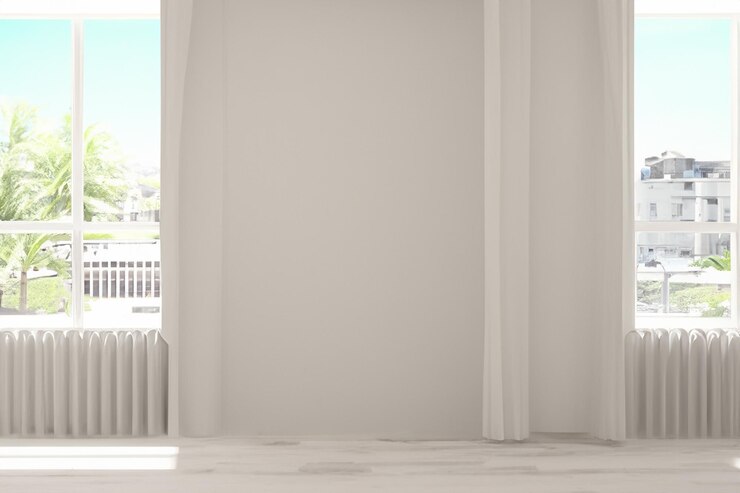una cortina blanca que está abierta a una ventana