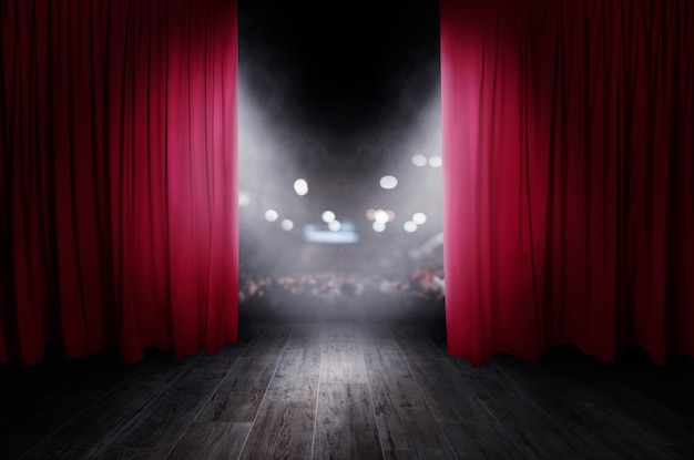 Foto las cortinas rojas se abren para el espectáculo de teatro.