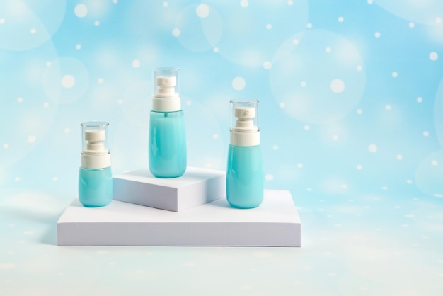 cosmetic containers without labels are displayed on a white podium