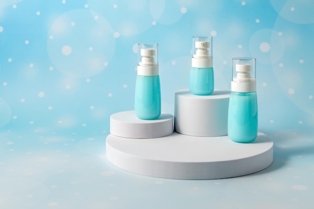 Cosmetic containers without labels are displayed on a white podium