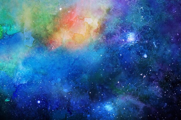 Un cosmos y estrellas pintados a mano en un papel de acuarela con una imagen de nebulosa de tinta de mármol crea un colorido fondo espacial abstracto