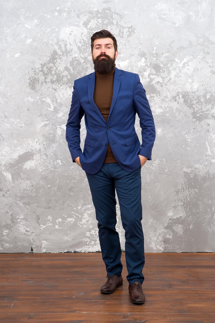 Foto costumava parecer perfeito homem de negócios barbudo bonito usa terno formal de luxo moda masculina e conceito de moda cara modelo de moda brutal pessoas de negócios estilo de moda roupas formais para escritório
