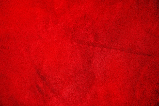 Couro de camurça vermelha como pano de fundo. Textura de veludo vermelho.