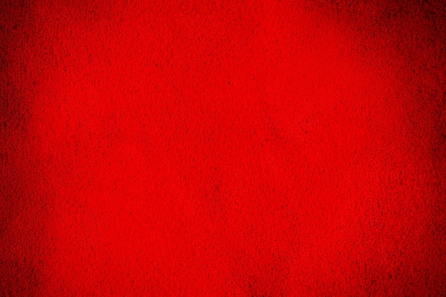 Couro de camurça vermelho natural como pano de fundo. Veludo cor de vinho close-up.