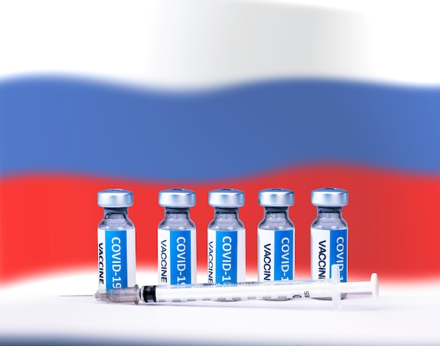 Covid 19 Corona-Virus-Impfstoffflaschen und -Spritze mit einem Hintergrund der russischen Nationalflagge