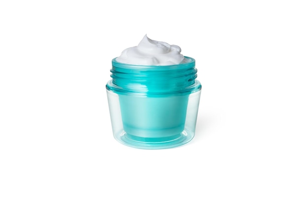 Foto crema facial recipiente de vidrio azul con crema sobre fondo blanco