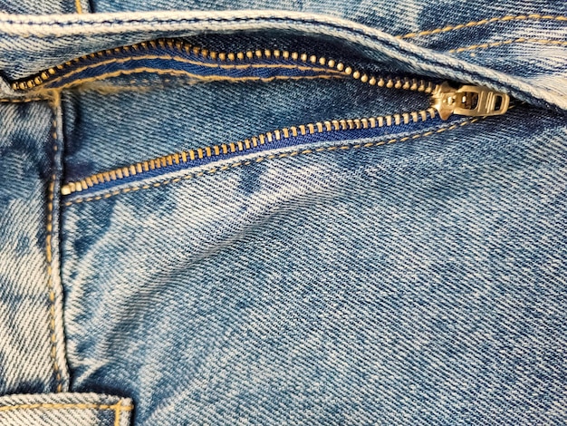 Cremallera en jeans jeans textura primer plano denim fondo descomprimido jeans