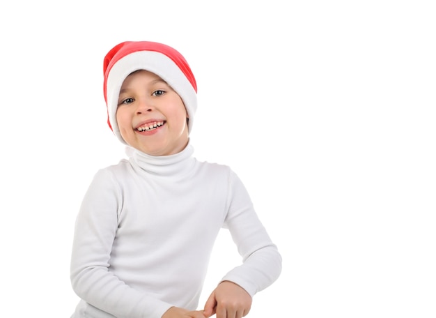 Foto criança rindo com chapéu de papai noel em fundo branco isolado