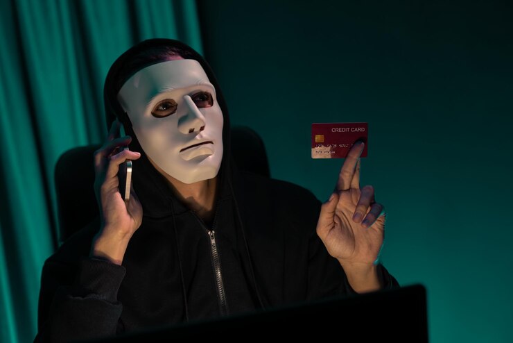 Foto el criminal de máscara blanca llama al dueño de la tarjeta de crédito para amenazar con un rescate pecuniario