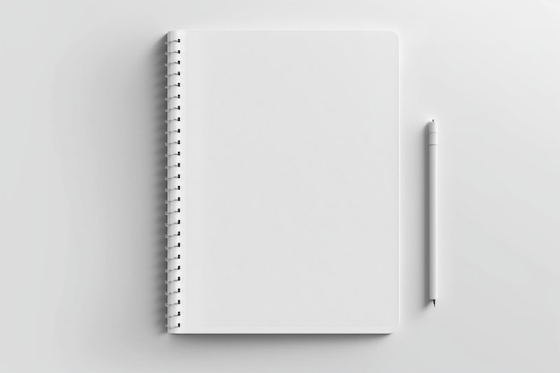 Un cuaderno blanco con un bolígrafo blanco sobre una superficie blanca.