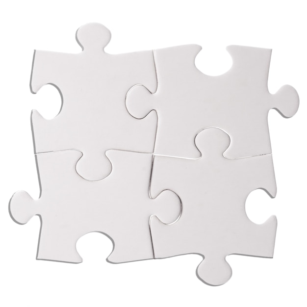 Foto cuatro piezas de un rompecabezas aislado en el recorte de fondo blanco.