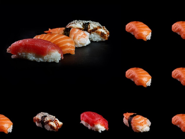 Cuatro tipos de sushi nigiri sobre un fondo negro