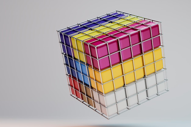 cubo multicolor en una jaula de hierro sobre un fondo gris.