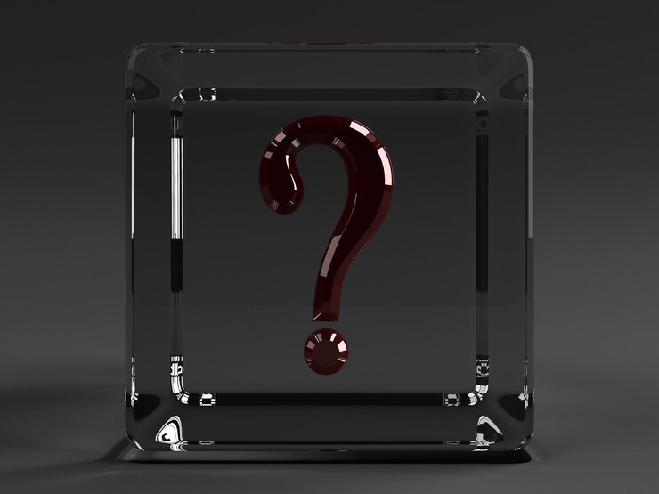 Foto cubo transparente con un signo de interrogación rojo