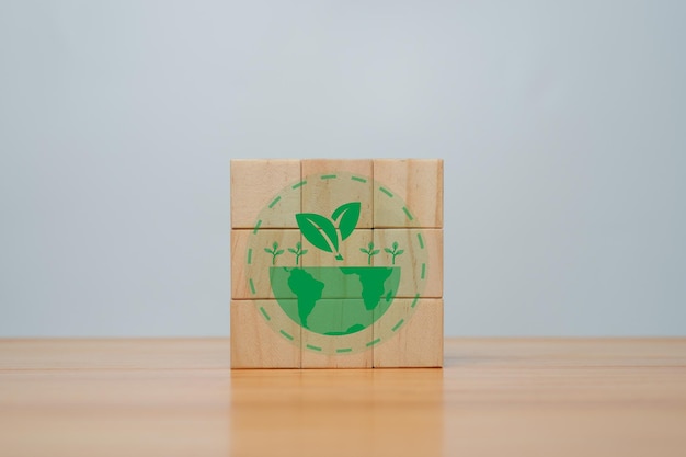 Foto cubos de madera de estrategia climáticamente neutral a largo plazo con reducción de emisiones de carbono e icono verde concepto neutral de carbono bajo en carbonobanne verde