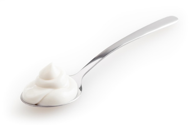 Foto cuchara de mayonesa aislado sobre fondo blanco con trazado de recorte
