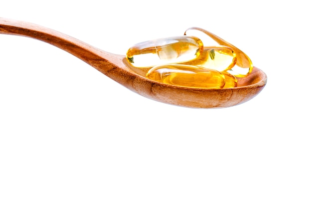 Cucharada de cápsulas de gel de omega 3.