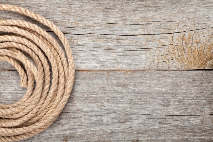 Foto cuerdas de barco sobre un fondo de textura de madera