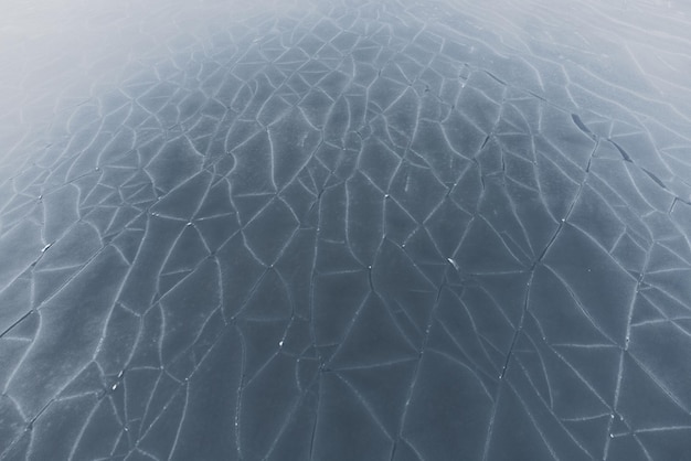 Un cuerpo de agua cubierto de hielo texturizado Vista superior Fondo de invierno