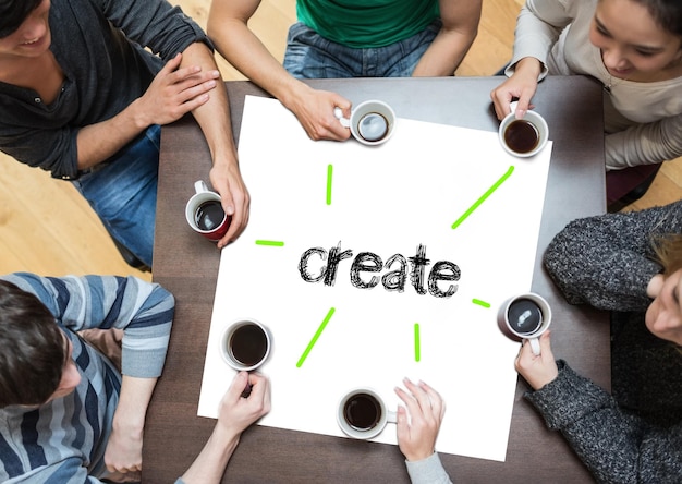 Foto das wort „create“ auf einer seite mit menschen, die am tisch sitzen und kaffee trinken