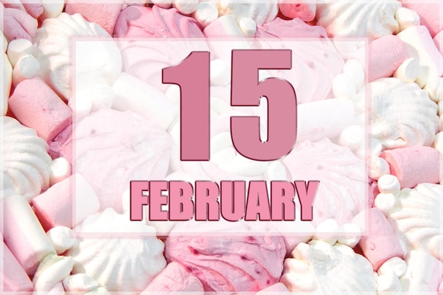 Data do calendário no fundo de marshmallows brancos e rosa 15 de fevereiro é o décimo quinto dia do mês