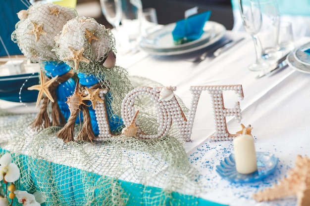 Decoración. estrella de mar. Embarcacion. letras. Boda. Banquete. mesa.